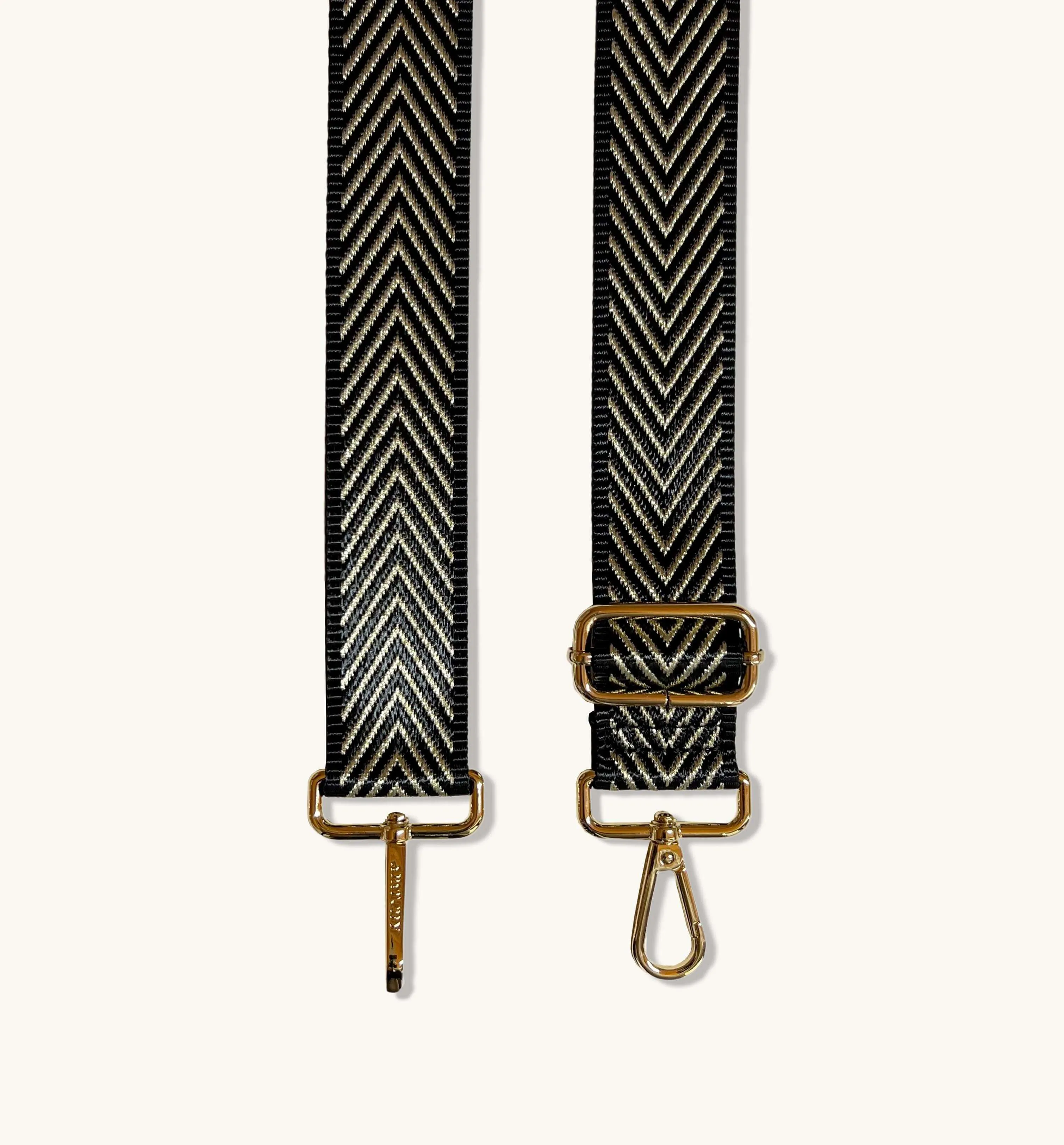 The Tassel Black Leather Crossbody Bag With Black & Gold Chevron Strap