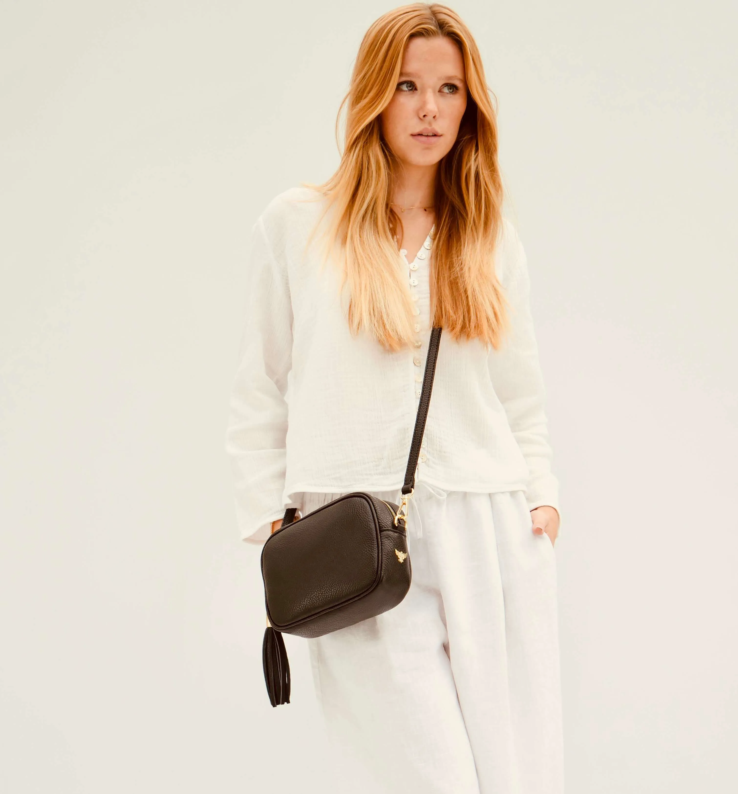 The Tassel Black Leather Crossbody Bag With Black & Gold Chevron Strap